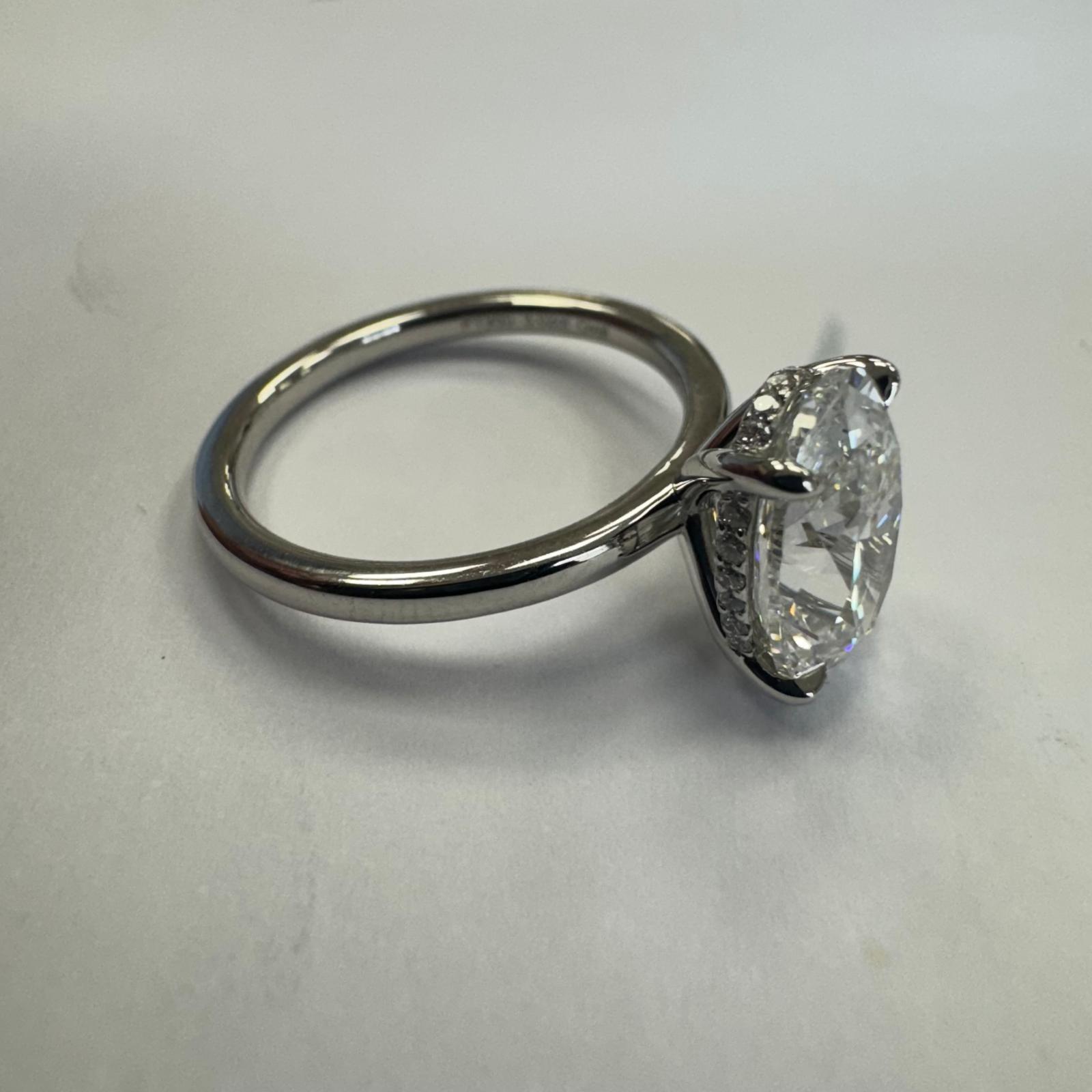 Oval Cut Diamond Hidden Halo Ring - 3.12ct TW